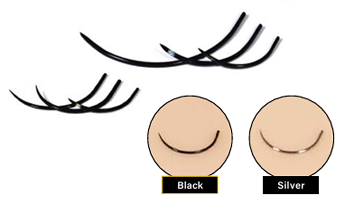 Comparison image of black and silver surgical needles, showing appearance on skin