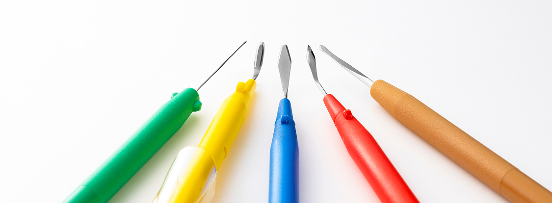 Five types of MANI Ophthalmic Knife with colorful handles (green, yellow, blue, red, brown), displayed in a row on a white background.