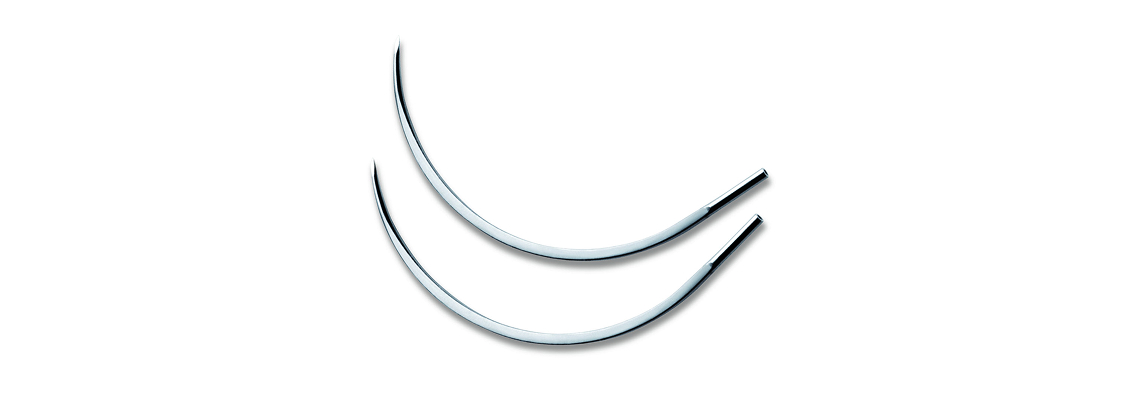 Two curved surgical needles placed on a white background